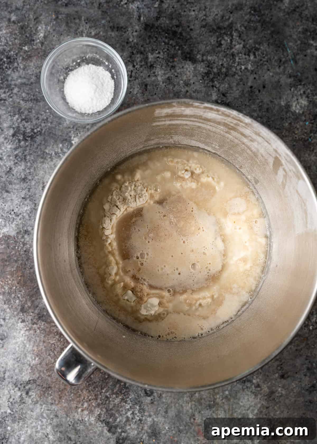 Classic Balkan Flatbread Lepinja 5 overhead process shot: ingredients for the lepinja recipe poured in mixing bowl