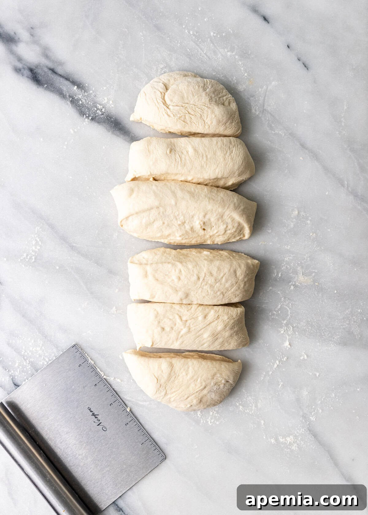 Classic Balkan Flatbread Lepinja 8 overhead process shot: sliced dough on cutting board