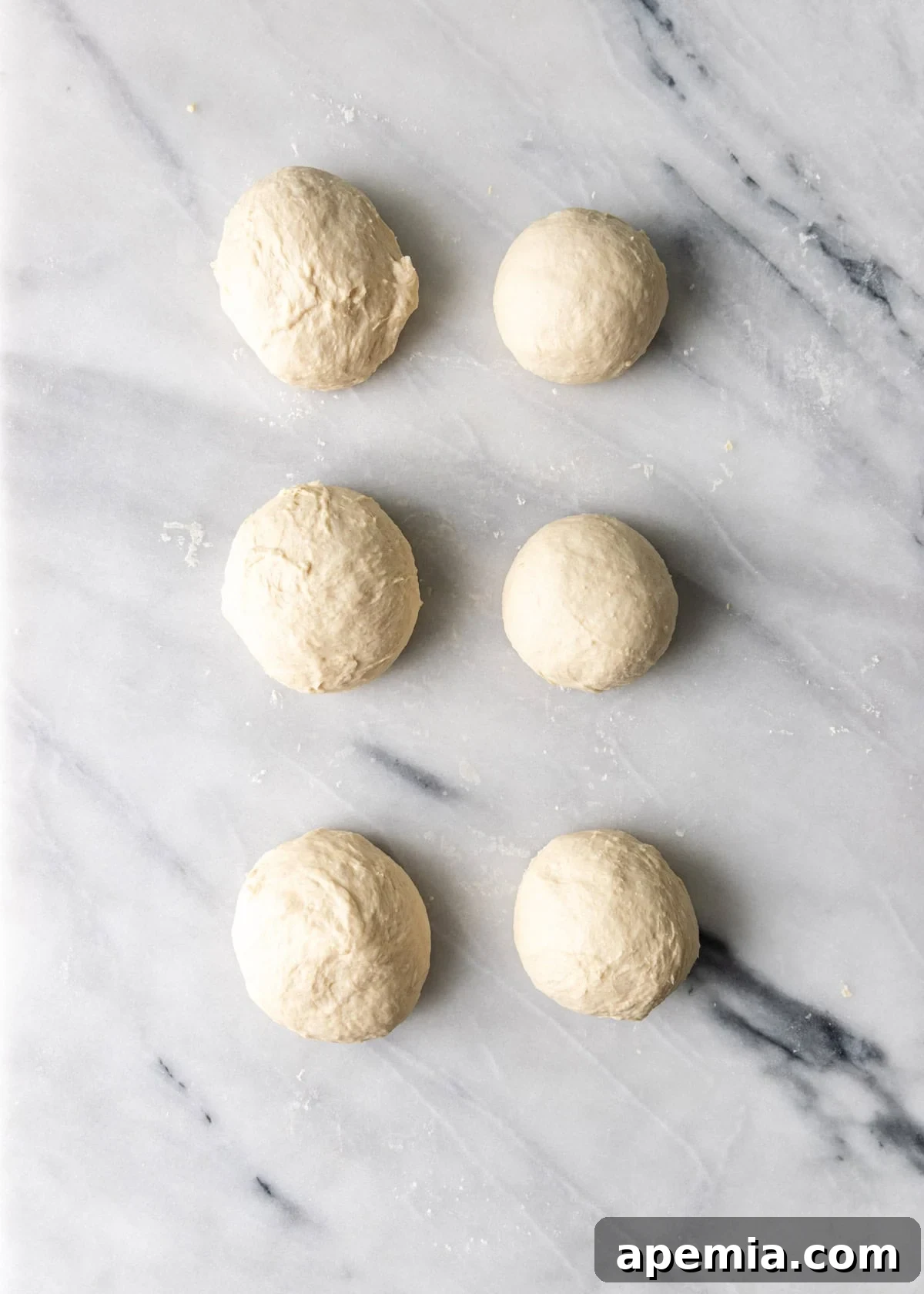 Classic Balkan Flatbread Lepinja 9 overhead process shot: 6 balls of dough on top of cutting board