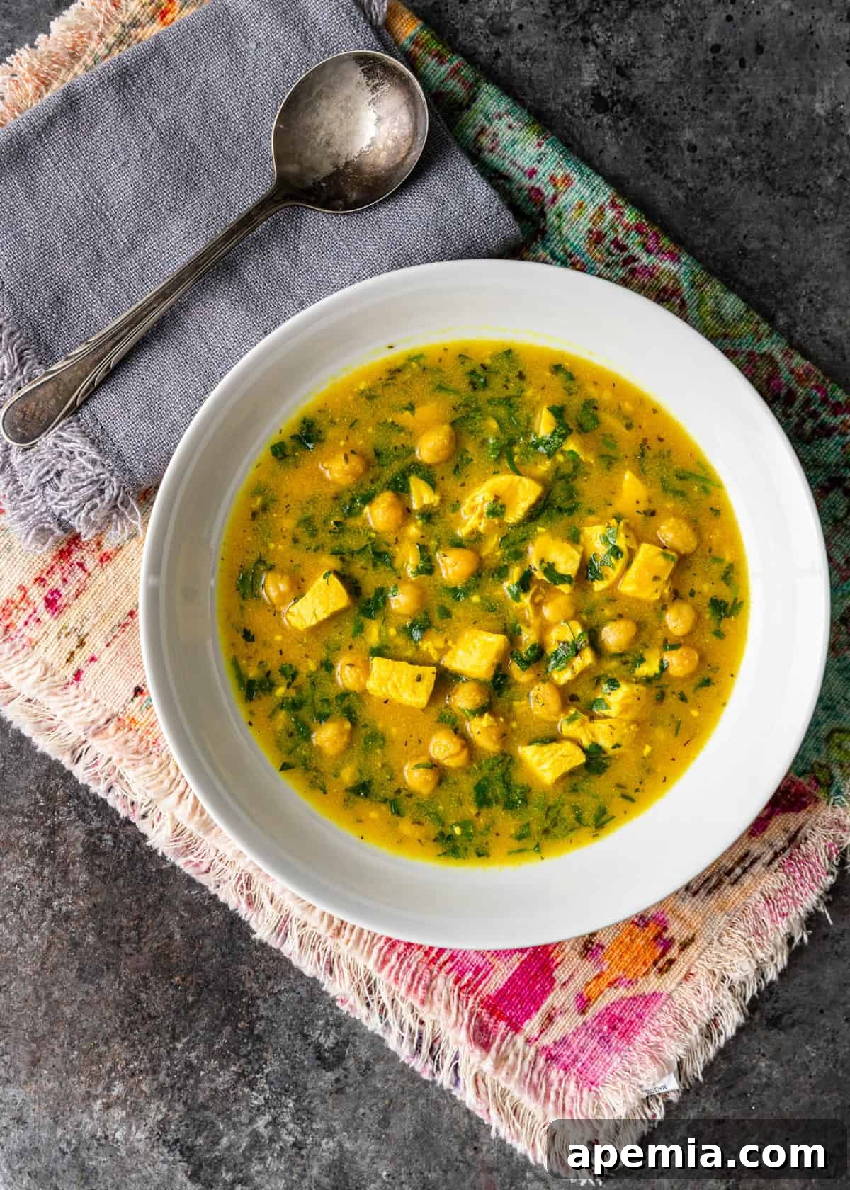 A finished bowl of Moroccan semolina soup ready to be served, viewed from overhead.