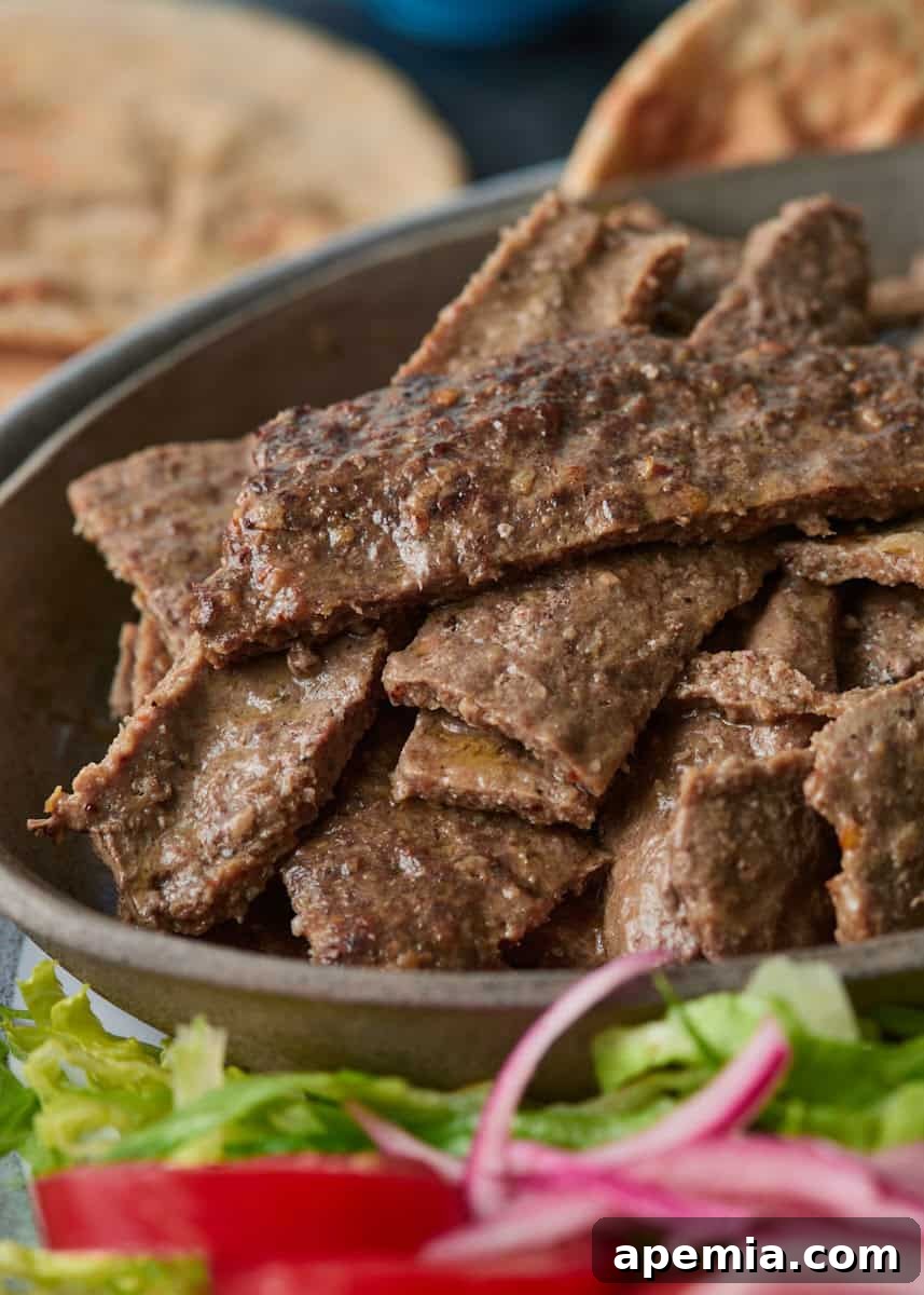 closeup side view: sliced beef on plate
