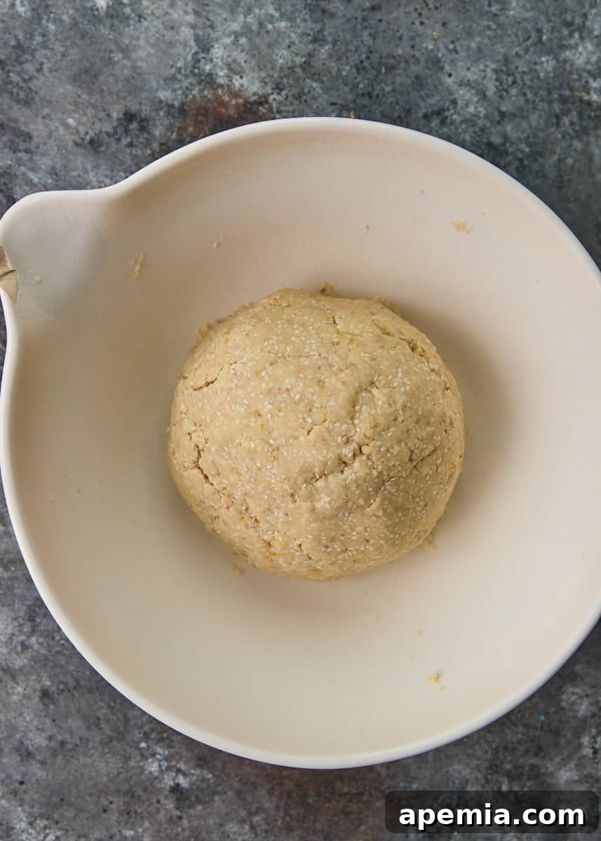 overhead process shot: mixed ingredients rolled in ball to make this shortbread cookies recipe