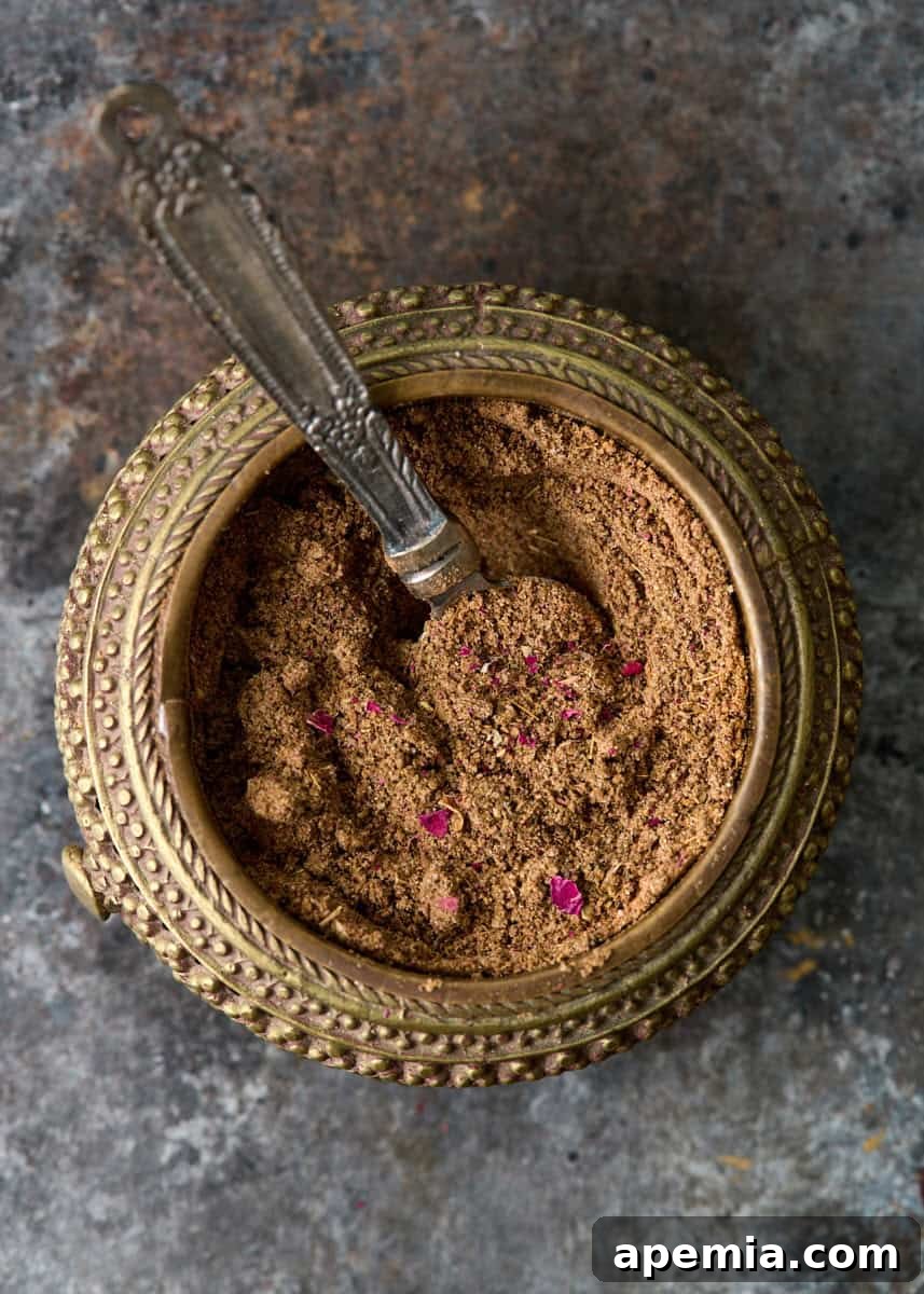 closeup overhead: kamouneh spice blend in serving dish with spoon