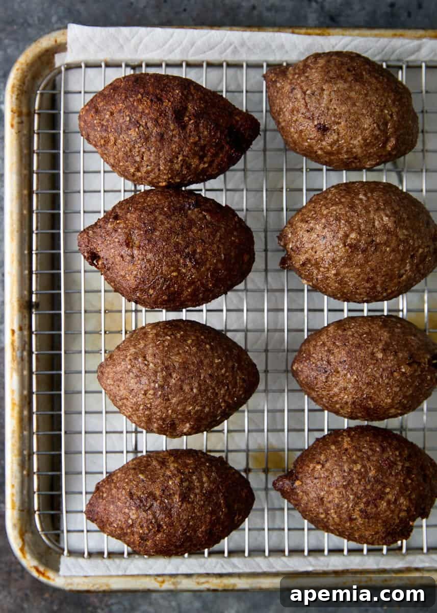 overhead: Kibbeh (Beef Croquettes) on baking sheet