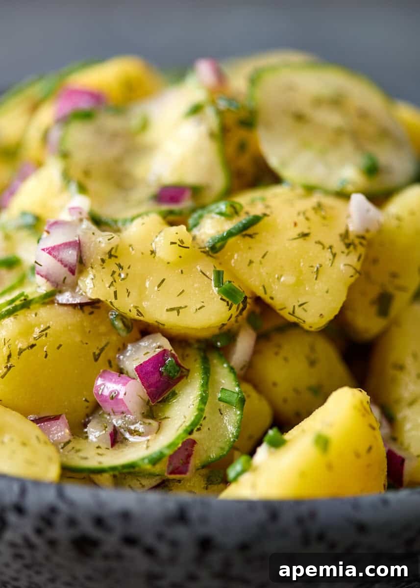 extreme closeup side view: warm potato salad