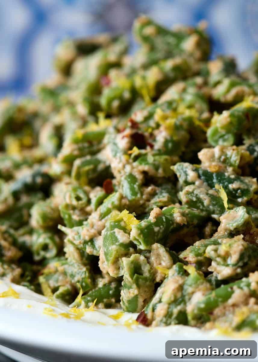 extreme closeup: green beans recipe on white plate